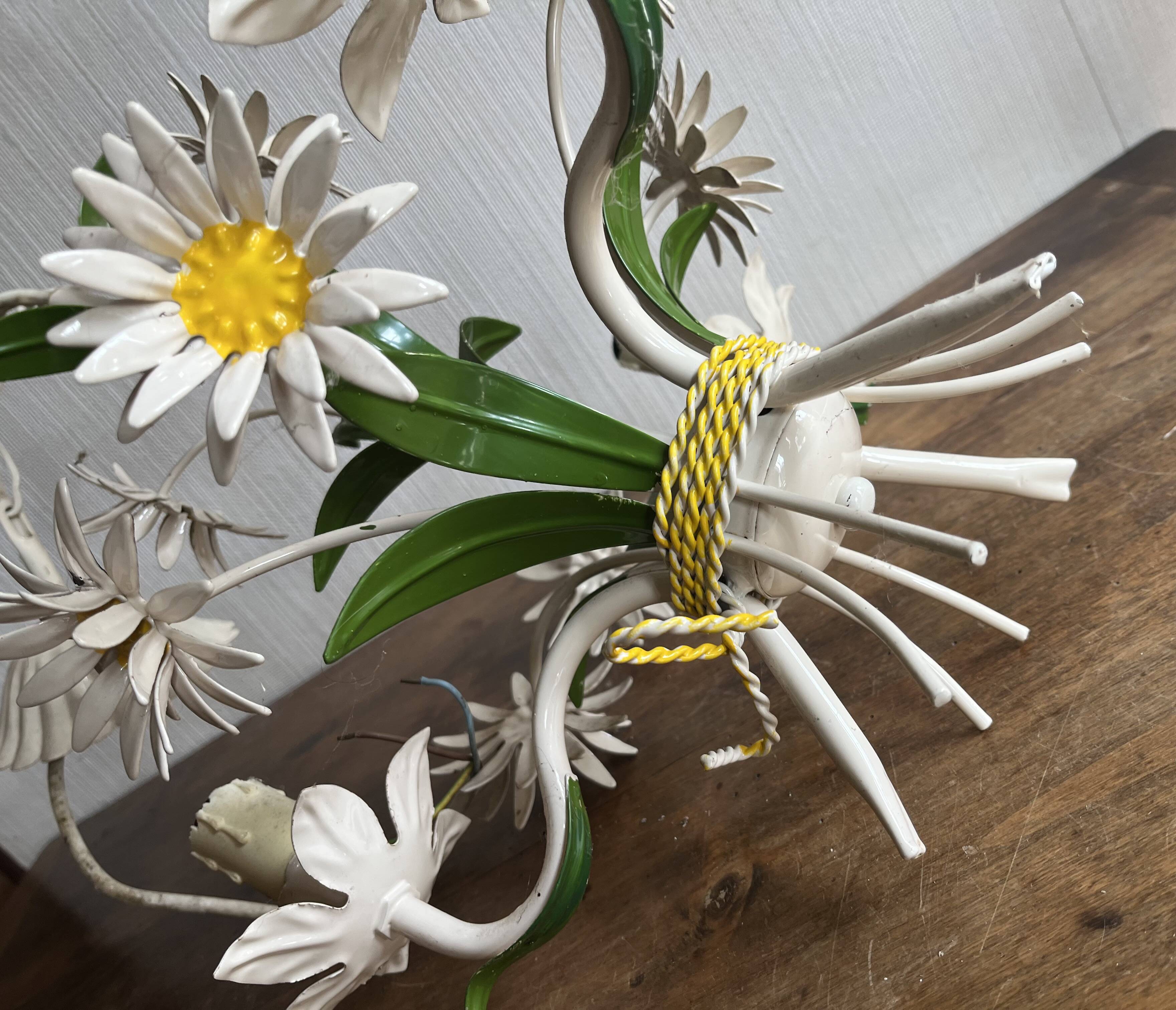 Sheet metal chandelier with daisy masks, 3 branches.