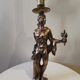 Large kerosene lamp mounted on bronze statue. Late nineteenth century