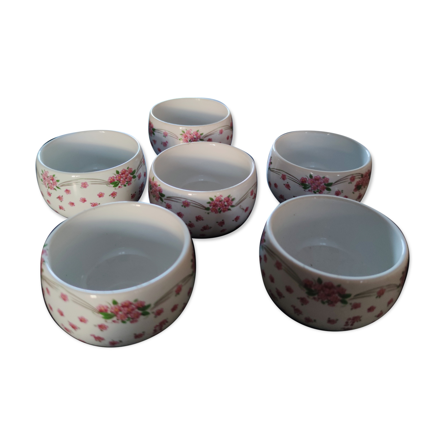 Service of small six cups for tea, cream, fruit salad or coffee