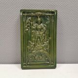 Antique tile in green faience, motif of Saint George and the dragon