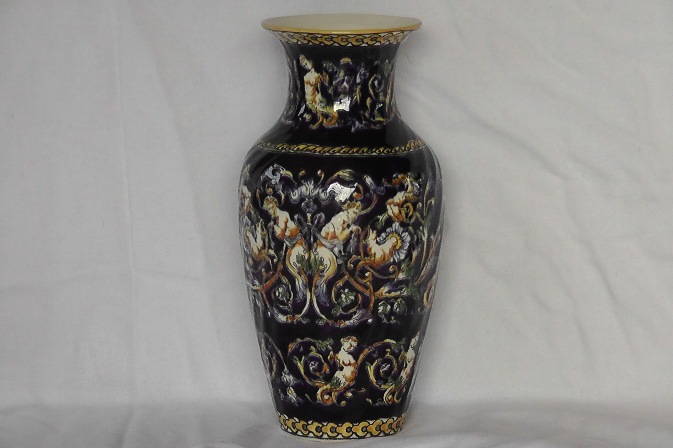 Gien earthenware vase on XX century blue background