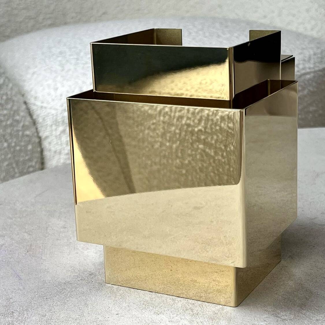 Cubical brass wall light