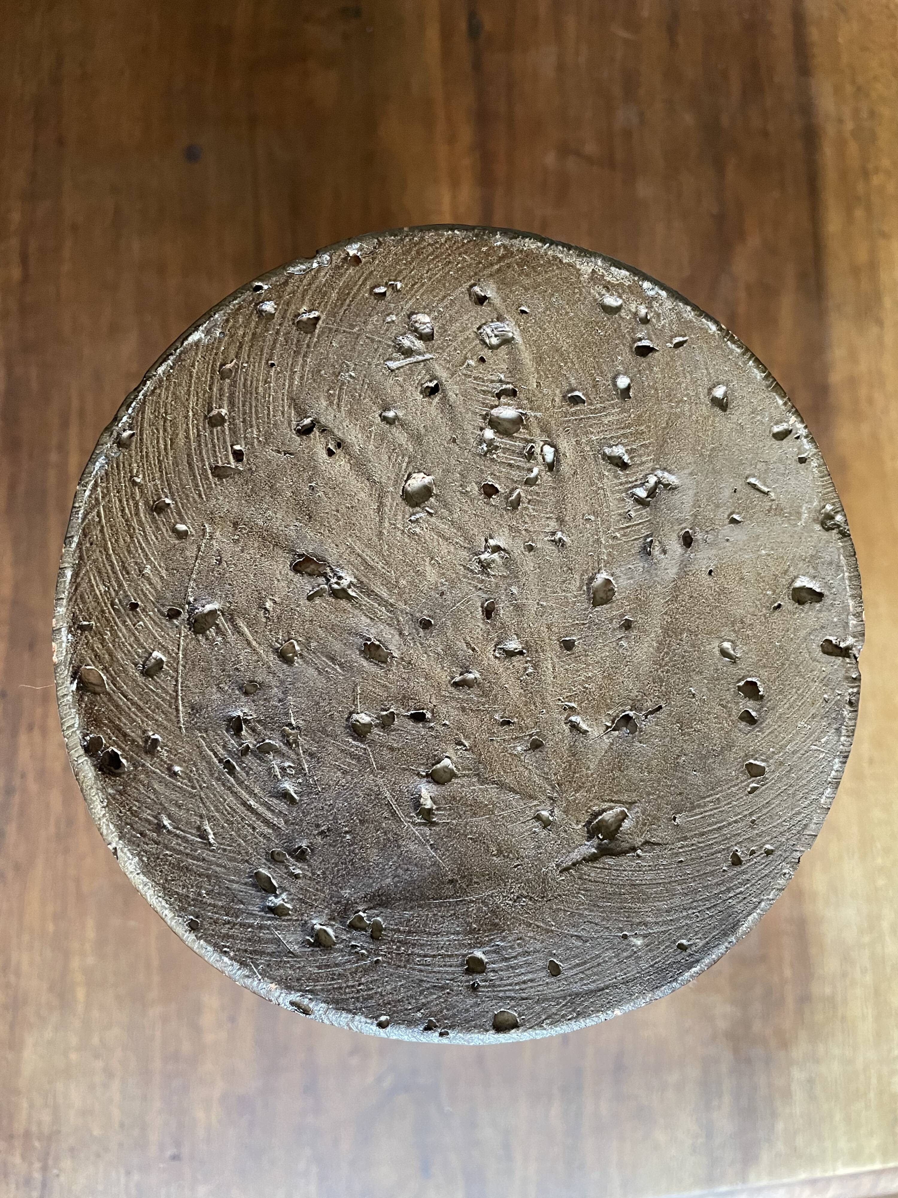 Brown enamelled terracotta candle holder