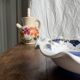 Small hand-painted earthenware salad bowl with garland of blue flowers, mark below
