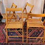 Set of 4 folding chairs in varnished wood