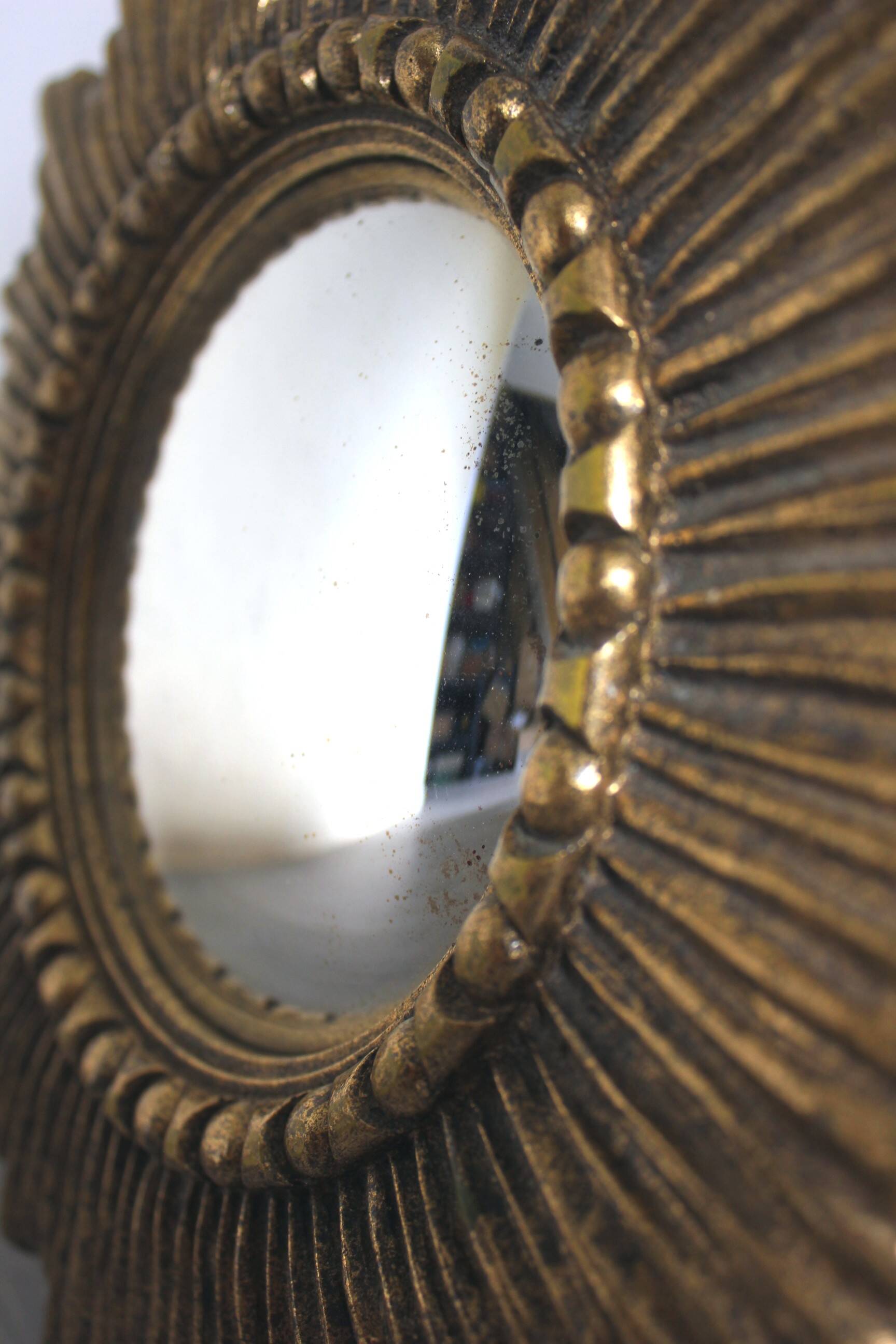 Golden sunburst convex vintage mirror from the 1960s.