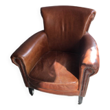 Industrial style aged leather armchair