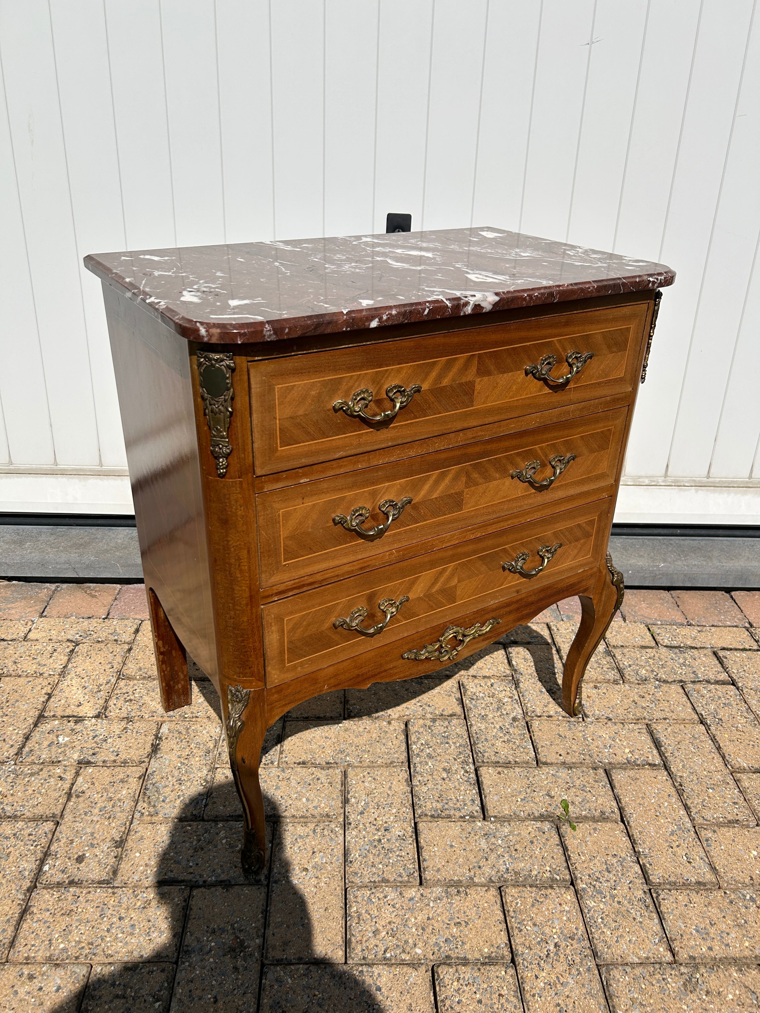 Marquetry commode in transitional style