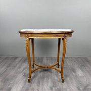 Oval guéridon table in carved wood and marble, Louis XVI style, 19th century.