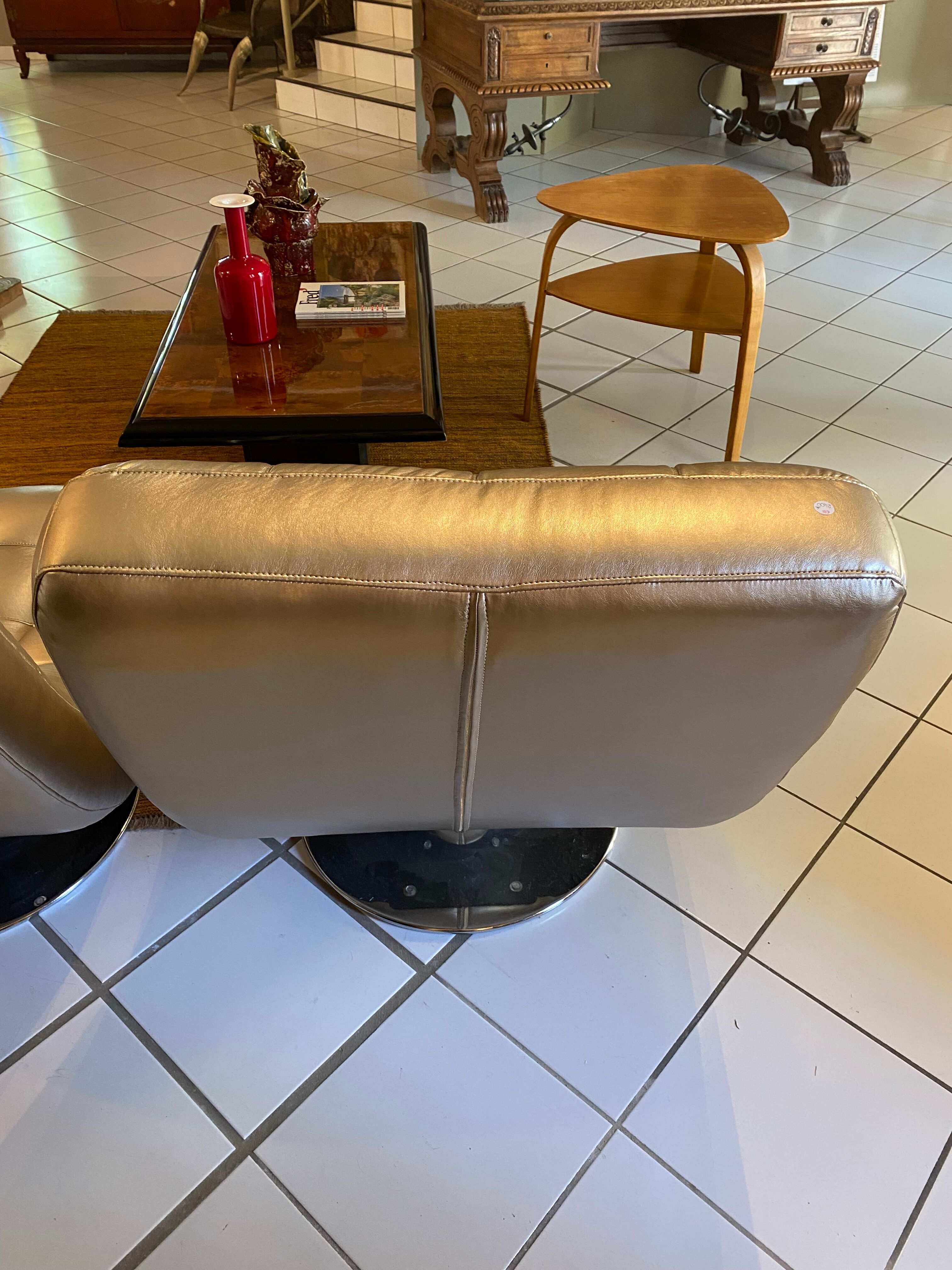 Pair of leather design armchairs