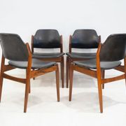 Set of four Arne Vodder chairs in hardwood and black leather.