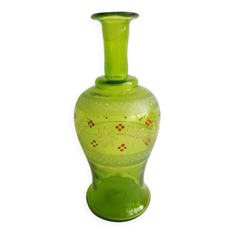 Old glass carafe with enameled floral motifs