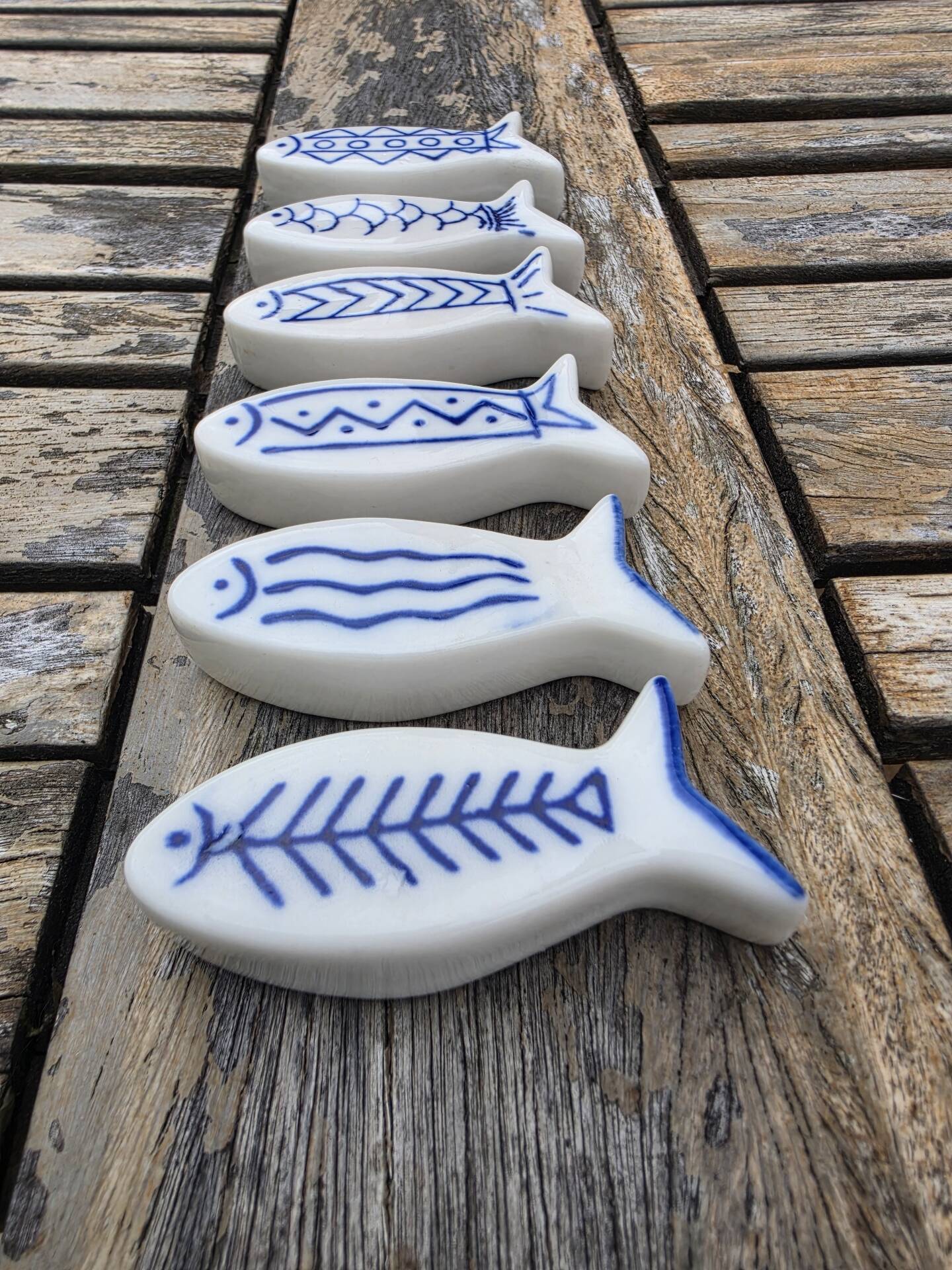 Set of 6 vintage ceramic painted fish motif spoon rests.