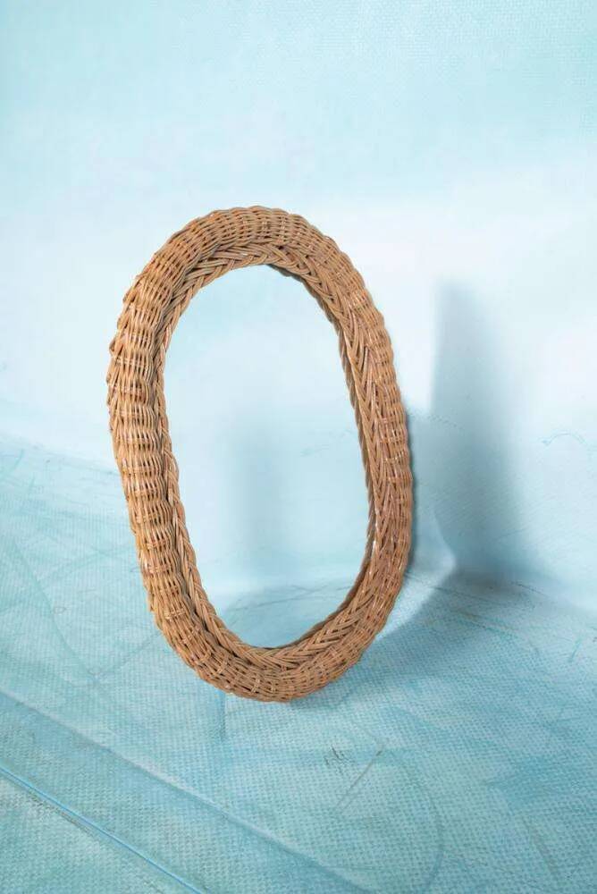 Vintage 70s bohemian wall mirror in woven rattan.