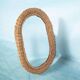Vintage 70s bohemian wall mirror in woven rattan.