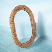 Vintage 70s bohemian wall mirror in woven rattan.