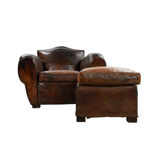 Club armchair and leather ottoman