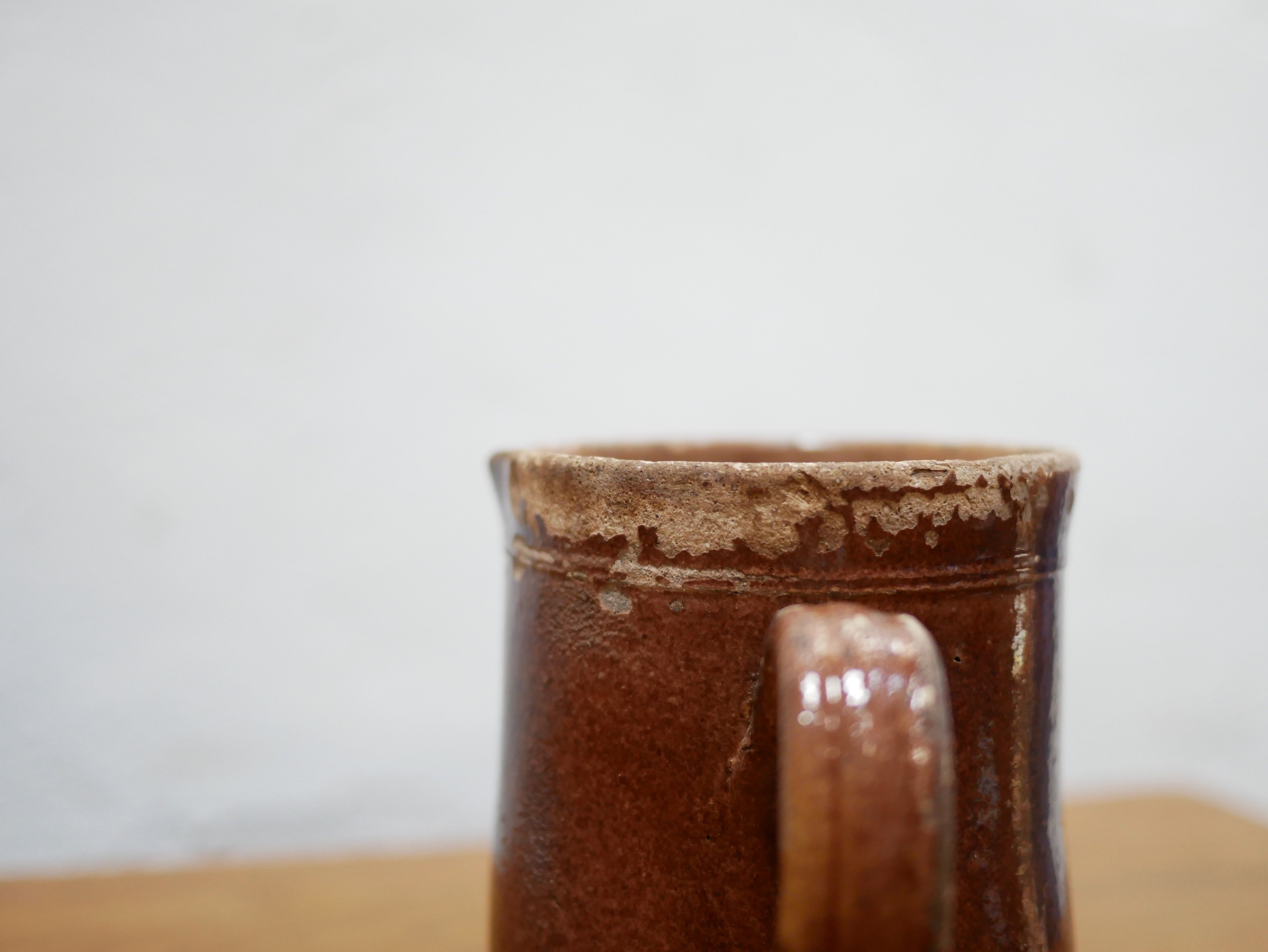 Vintage pitcher in glazed terracotta