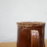 Vintage pitcher in glazed terracotta
