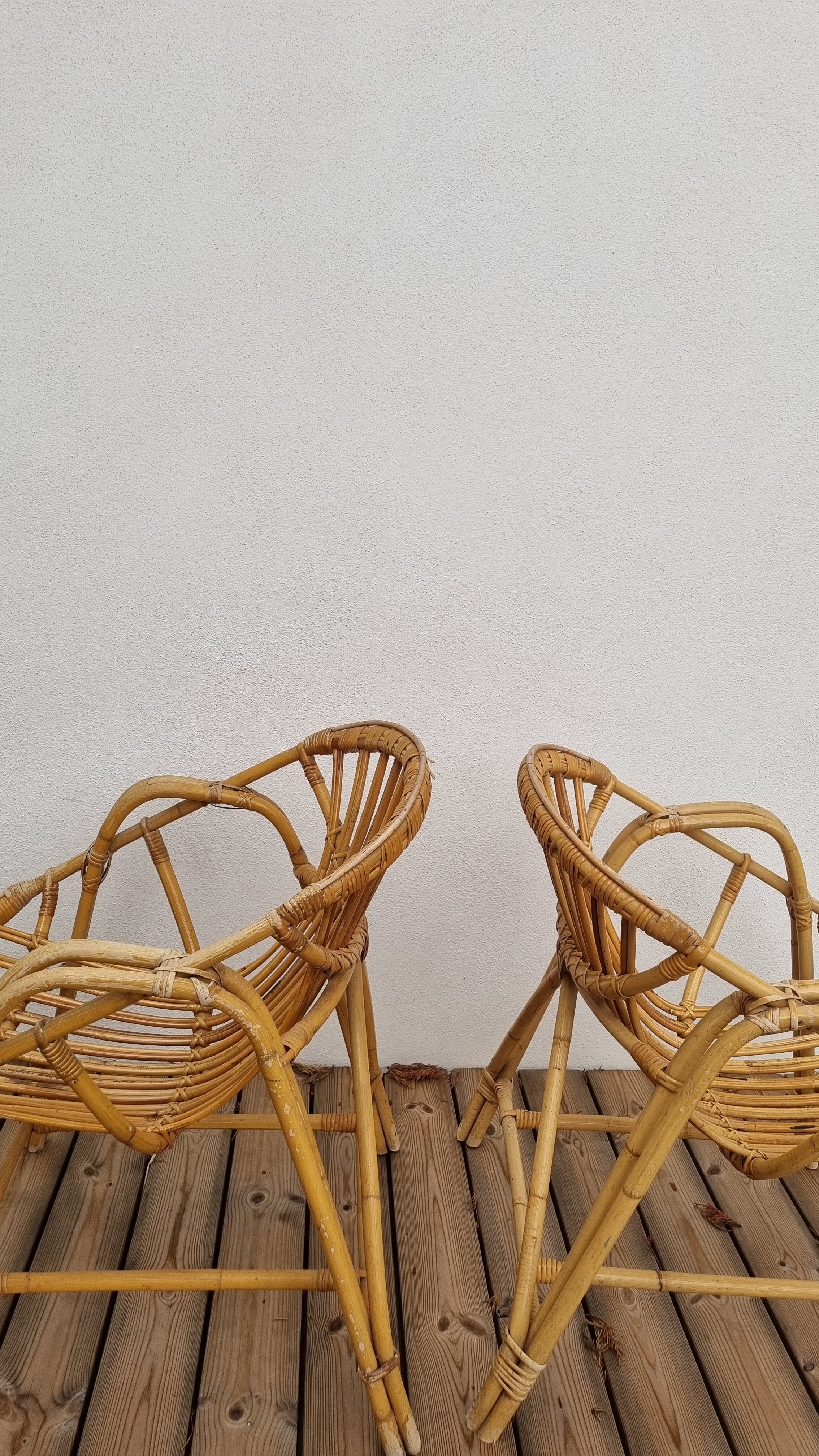 pair of Coquille rattan armchairs
