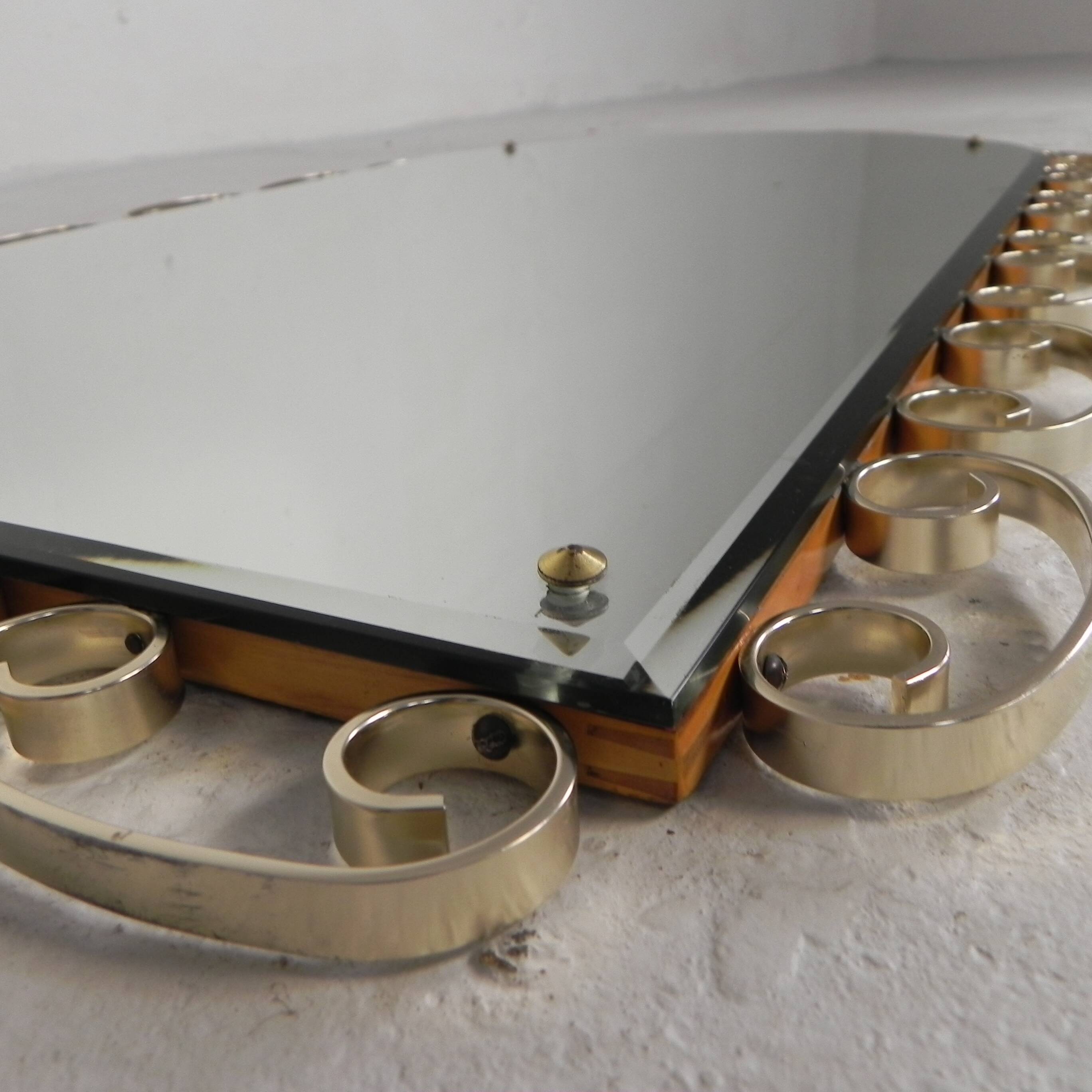 Vintage faceted mirror in an aluminium frame from the 1950s.