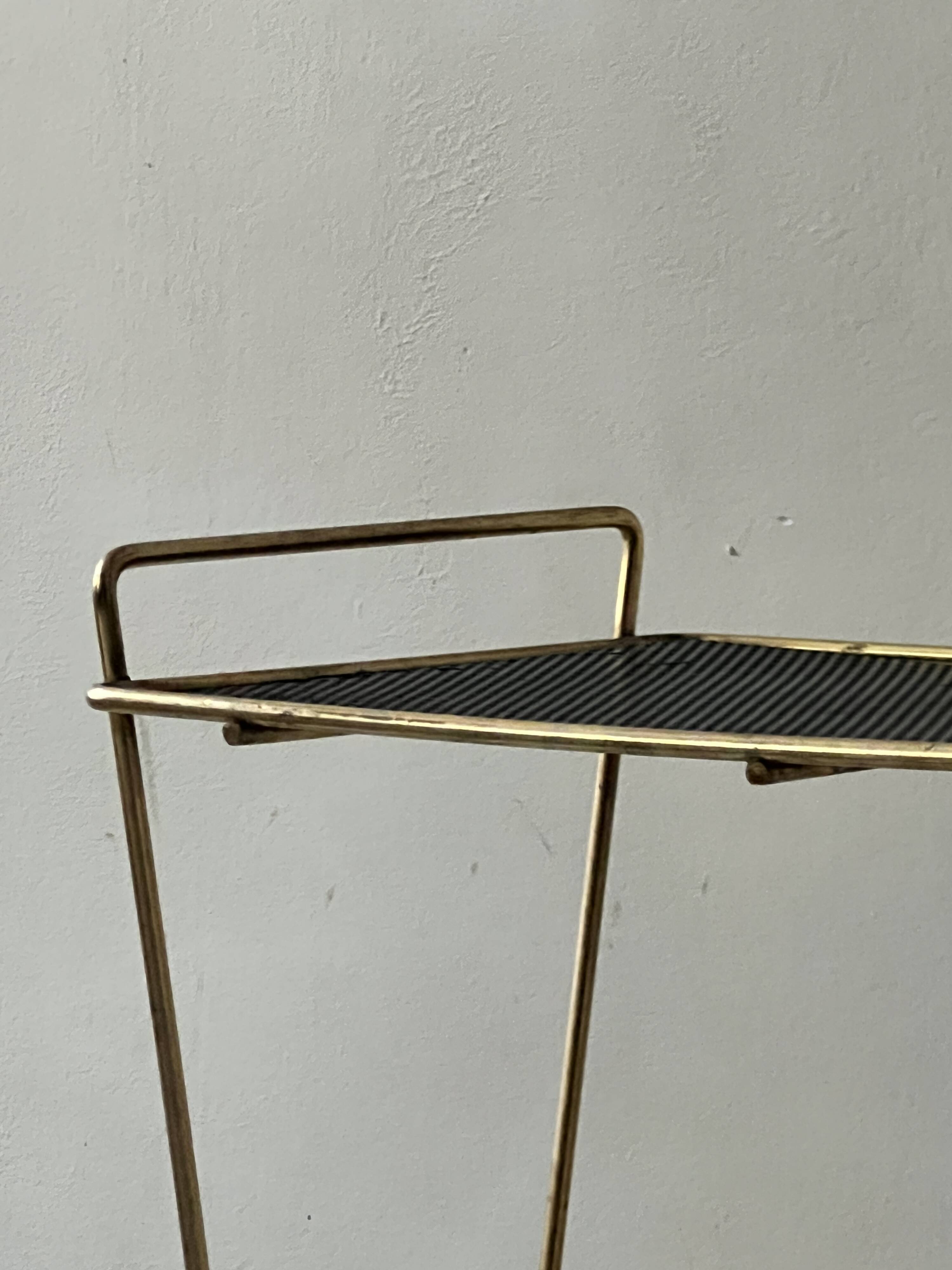 Side table - perforated metal magazine rack, designed by Matégot