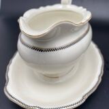 Porcelain sauce boat with black and gold checkered border