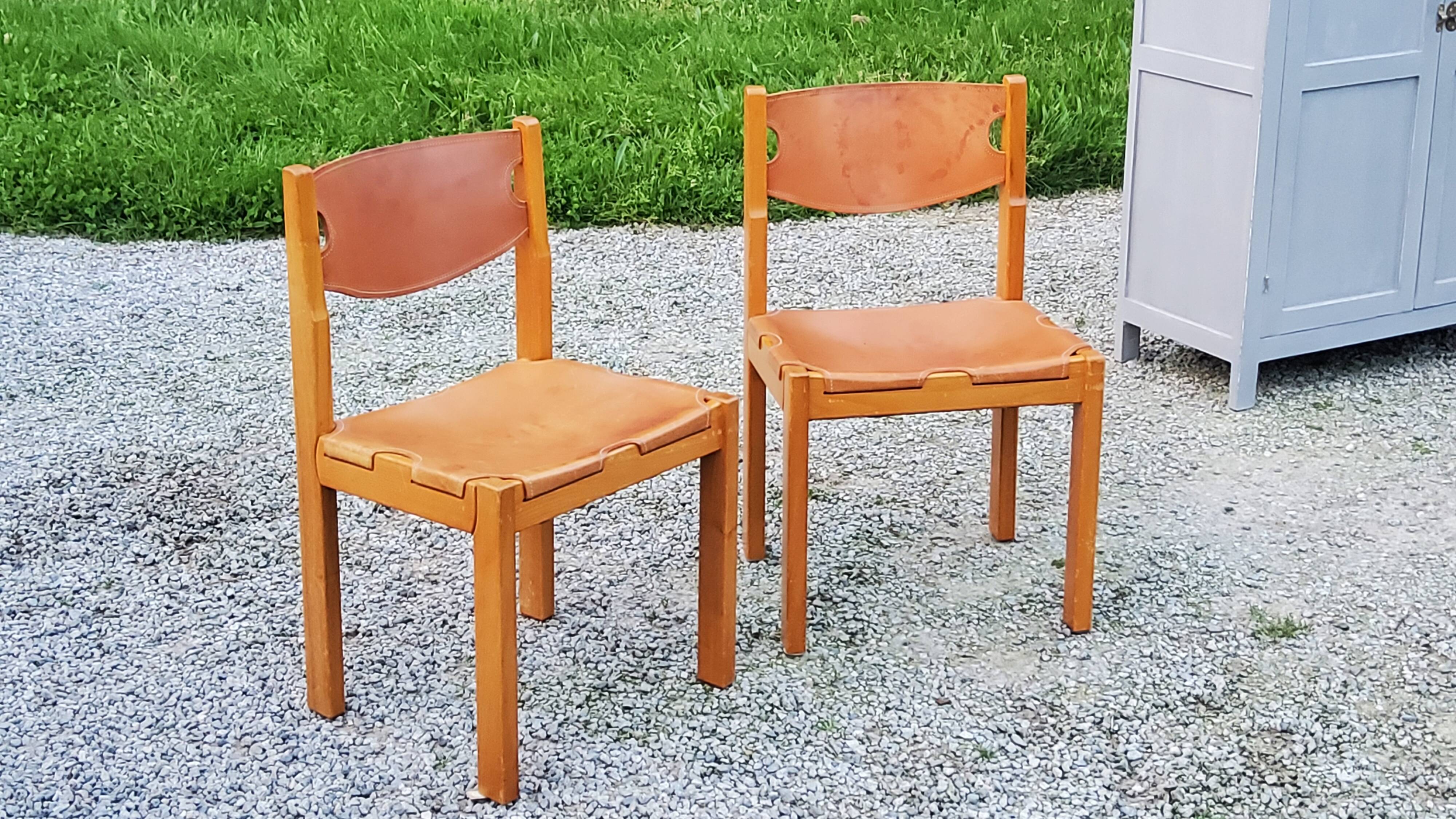 Pair of brutalist chairs in elm and stretched leather with saddle stitching Self publisher