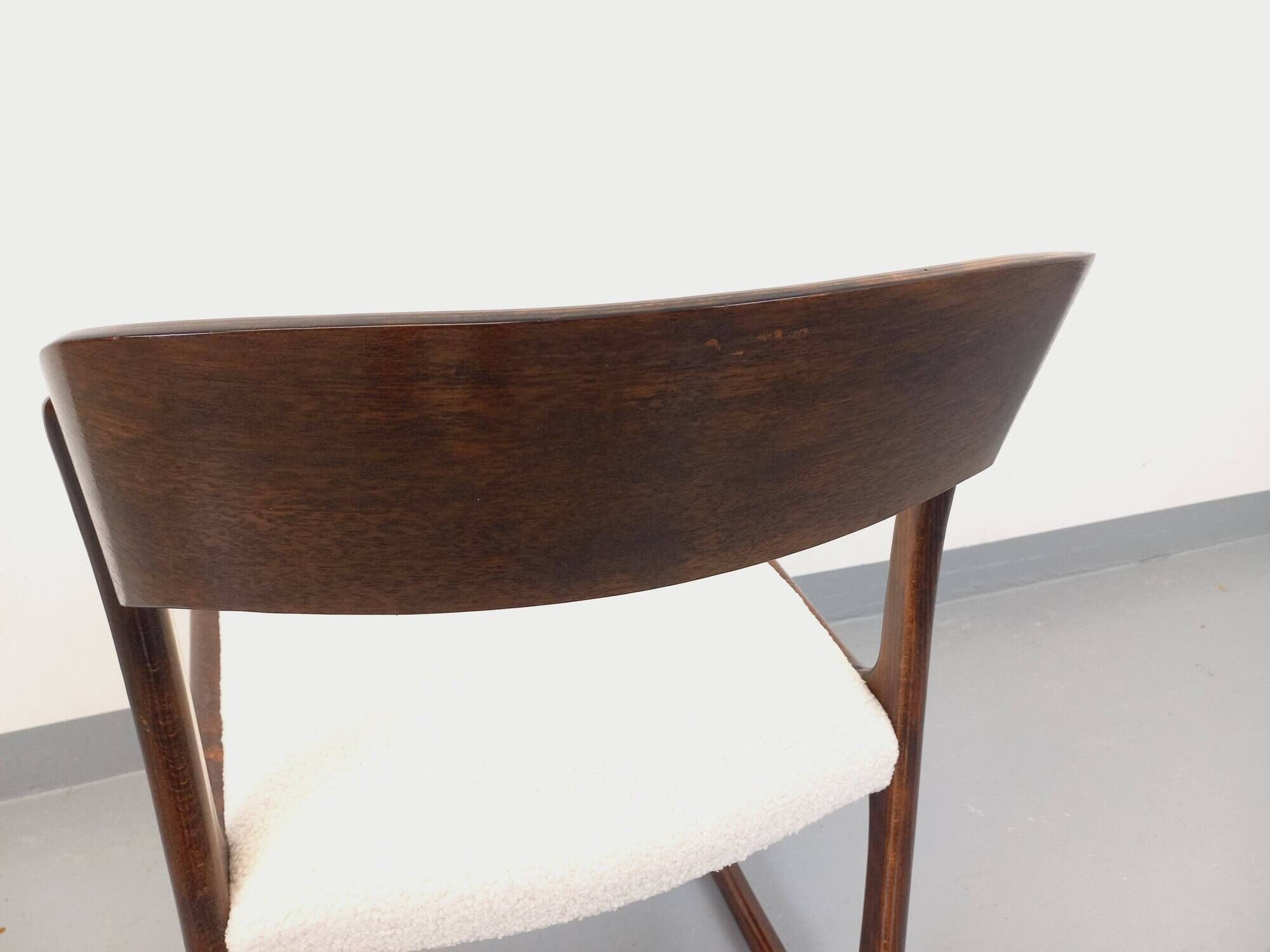 Vintage sled chair by Baumann in wood and boucle fabric.