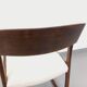 Vintage sled chair by Baumann in wood and boucle fabric.