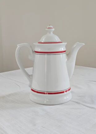White porcelain coffee pot by Winterling with red lines.
