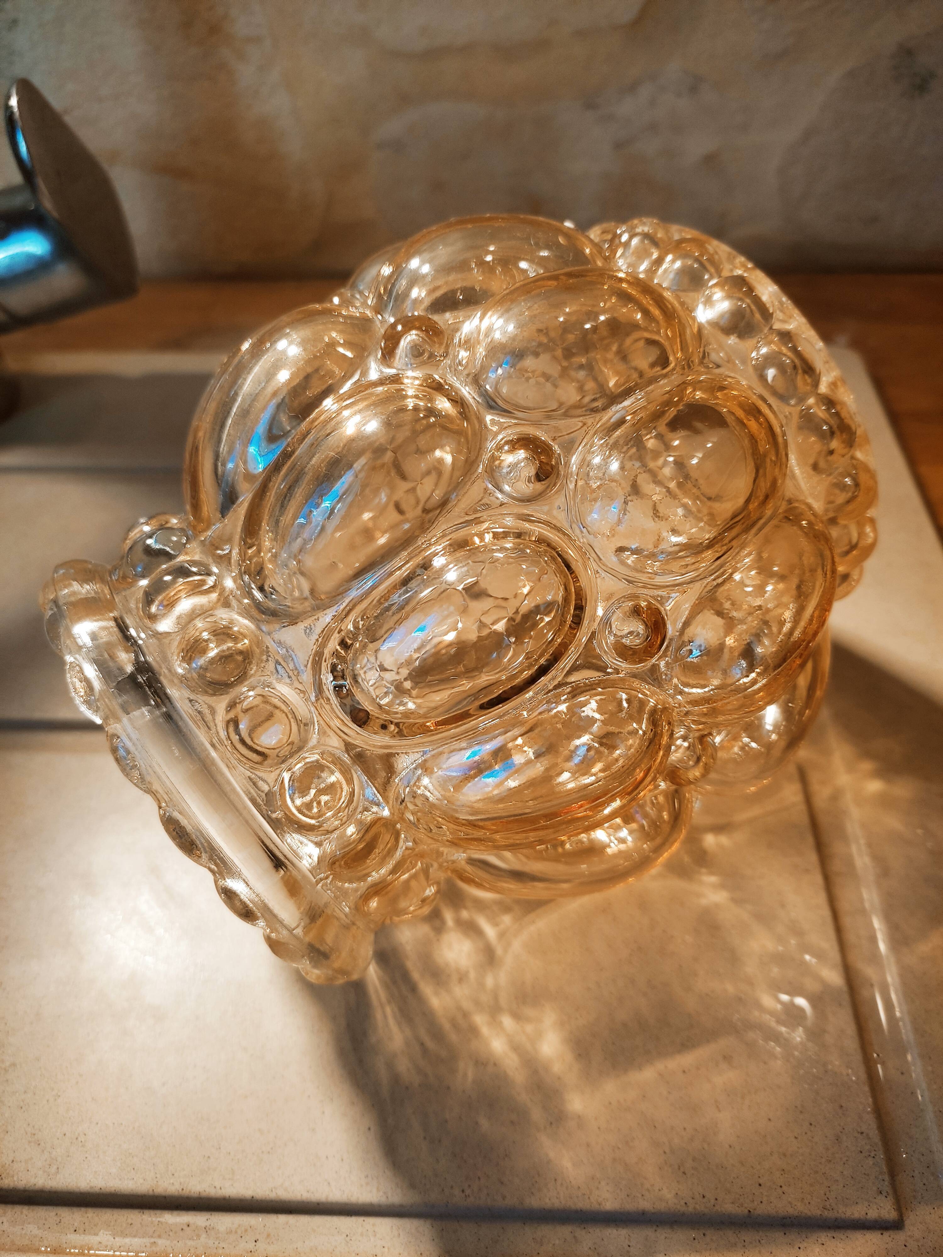 Tulip in iridescent golden glass