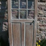 Porte vitrée en chêne brut
