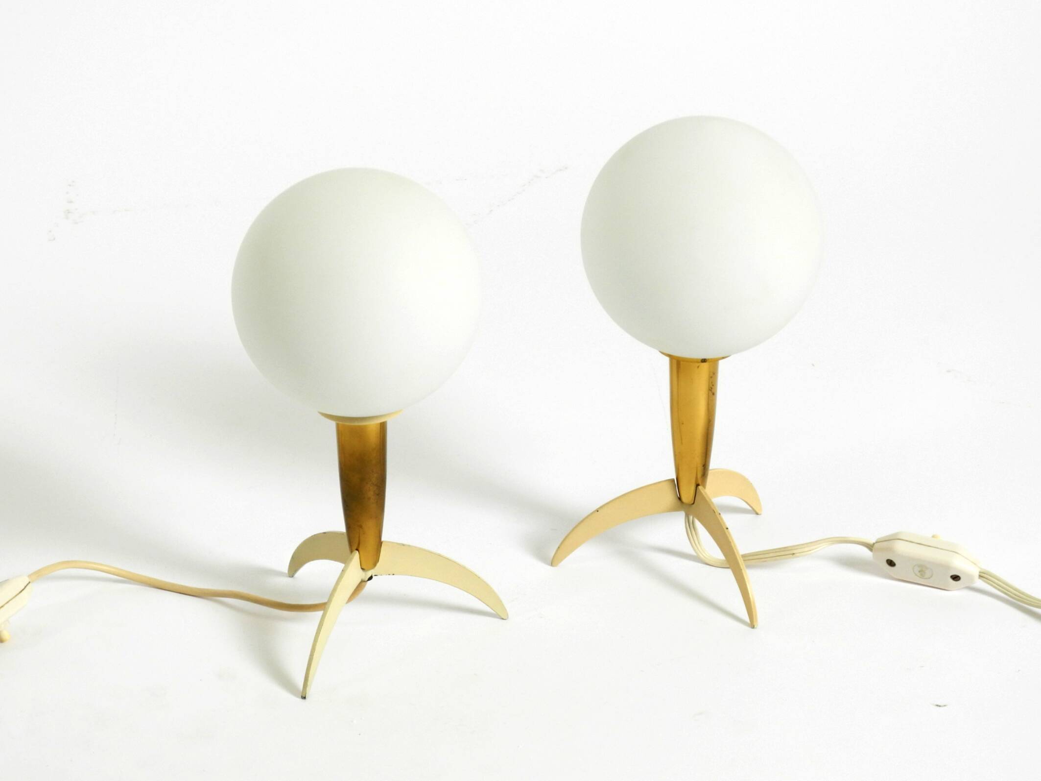 Two Mid-Century Modern rocket table lamps in brass and glass