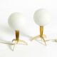 Two Mid-Century Modern rocket table lamps in brass and glass