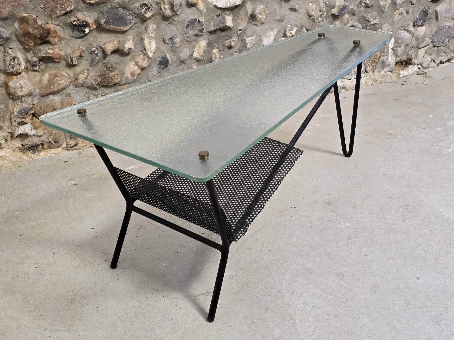 Coffee table in glass and black lacquered metal
