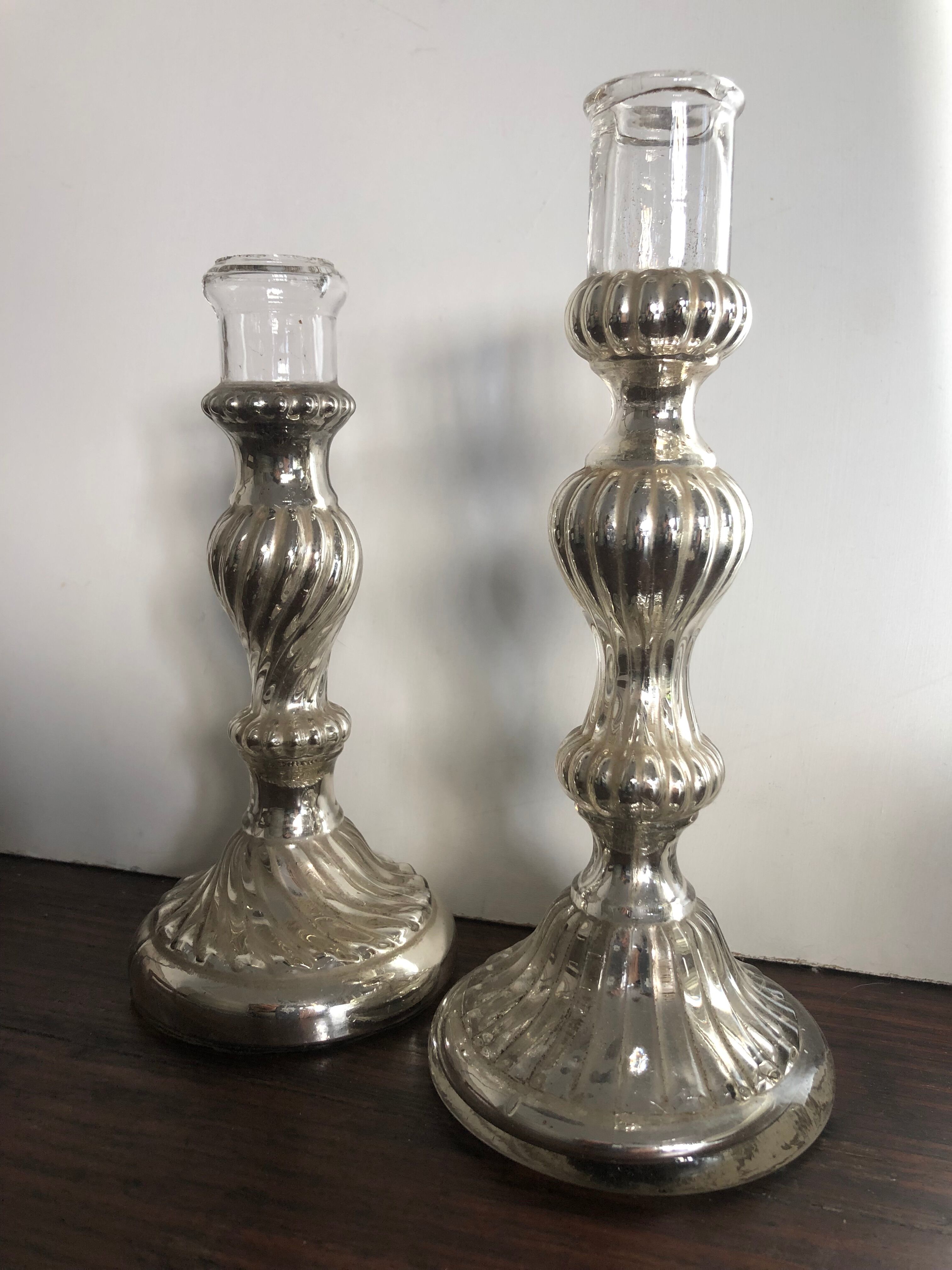 Pair of mercerized candle holders