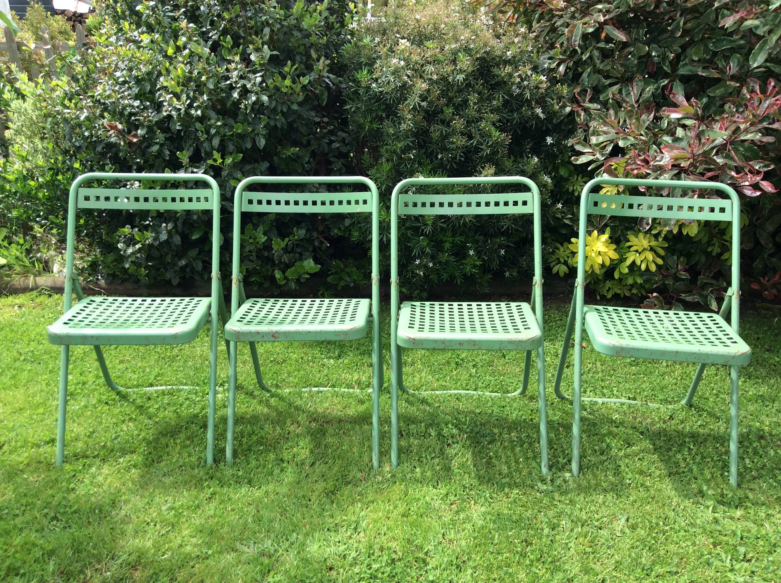 4 folding sheet metal chairs