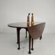 Antique English drop-leaf dining table – Victorian – 8 legs – oval shape – seats 8