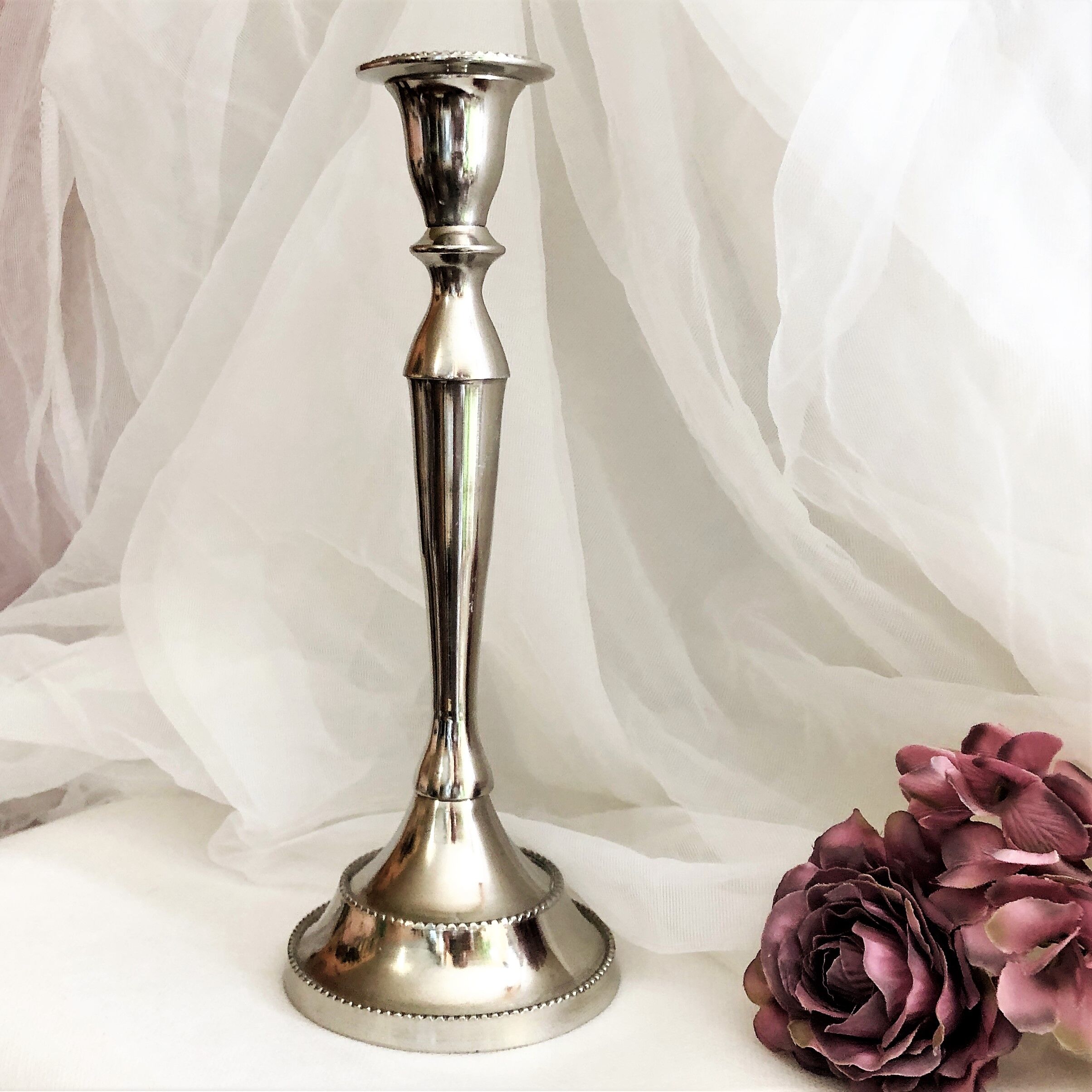 Chromed metal candle holder
