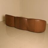 "Pumpkin" 3-seater canapé in patinated brown leather by Pierre Paulin for Arti.