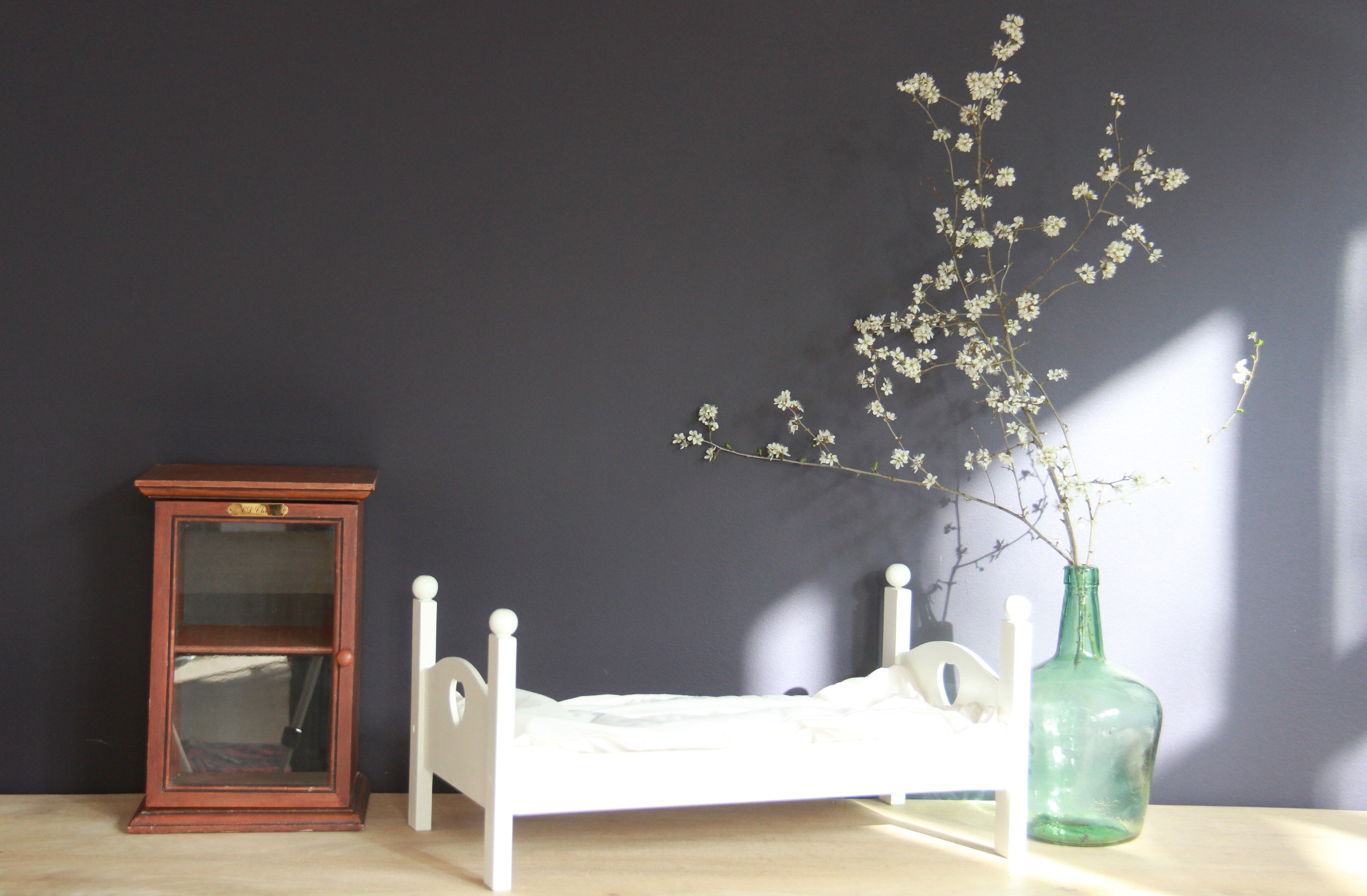 Painted wooden doll bed