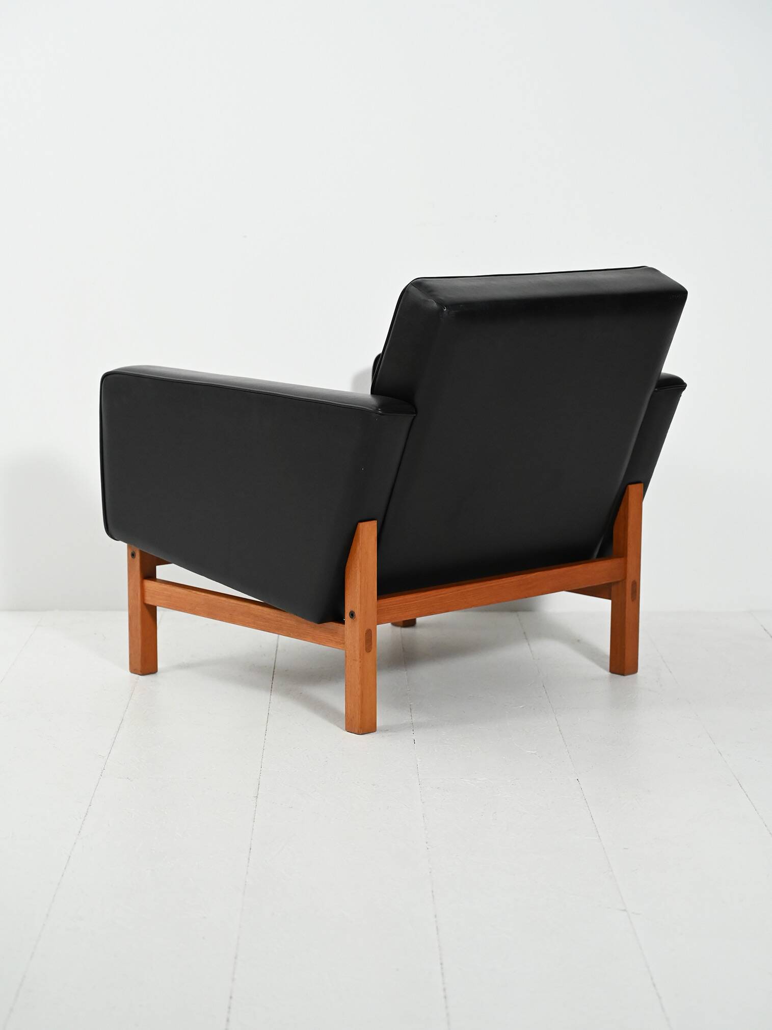 Swedish AB Futura teak and faux leather armchair