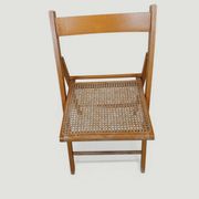 Vintage folding chair with caning.