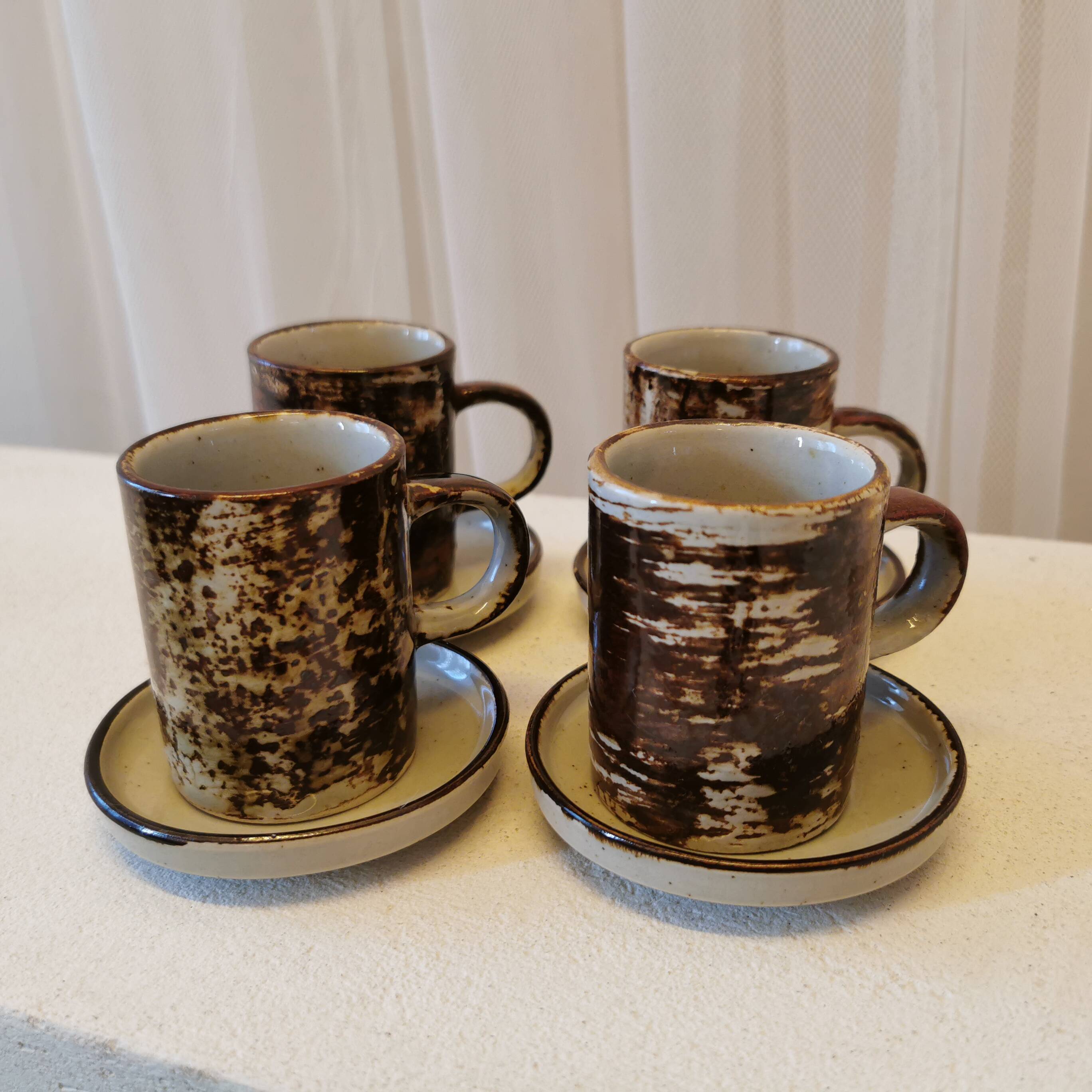 Set of 4 coffee cups and saucers