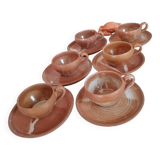 Set of vintage stoneware cups and saucers