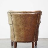 Nice, subtle cowhide armchair with a reversible kilim seat cushion