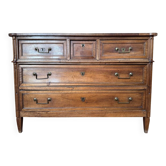 Louis XVI period chest of drawers in solid walnut.