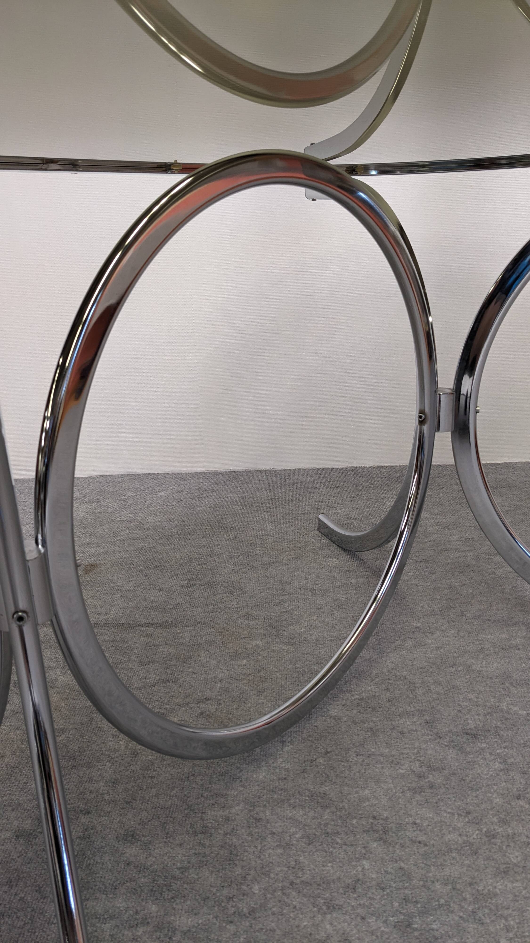 Chrome metal and smoked glass dining table, Italy circa 1970.