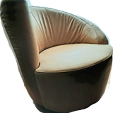 Pair of yellow leather swivel armchairs with asymmetrical armrests, circa 1980